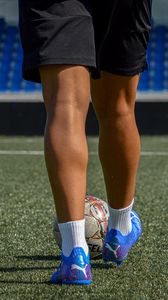 Preview wallpaper footballer, legs, ball, field, football, sport