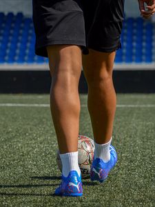 Preview wallpaper footballer, legs, ball, field, football, sport