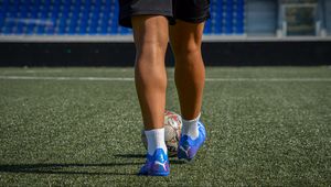 Preview wallpaper footballer, legs, ball, field, football, sport