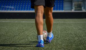 Preview wallpaper footballer, legs, ball, field, football, sport