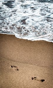 Preview wallpaper footprints, beach, coast, sand, sea