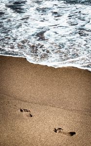 Preview wallpaper footprints, beach, coast, sand, sea