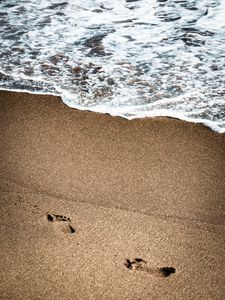 Preview wallpaper footprints, beach, coast, sand, sea