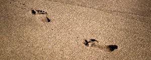 Preview wallpaper footprints, beach, coast, sand, sea