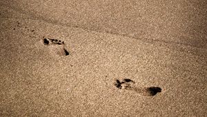 Preview wallpaper footprints, beach, coast, sand, sea