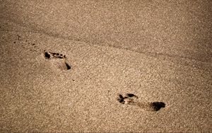 Preview wallpaper footprints, beach, coast, sand, sea