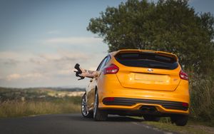 Preview wallpaper ford, car, legs, shoes, high-heeled shoes, tattoos, girl, rest, nature, ford focus st