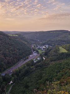 Preview wallpaper forest, hills, road, clouds, sky, dawn, nature