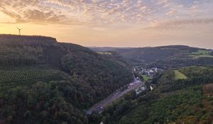 Preview wallpaper forest, hills, road, clouds, sky, dawn, nature