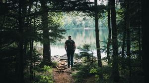 Preview wallpaper forest, lake, man, tourist, trees, nature