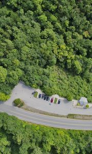 Preview wallpaper forest, trees, road, parking, cars, aerial view