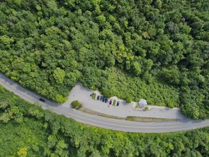 Preview wallpaper forest, trees, road, parking, cars, aerial view