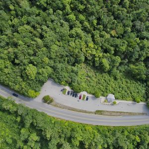 Preview wallpaper forest, trees, road, parking, cars, aerial view