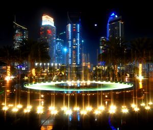 Preview wallpaper fountain, palm trees, street, lighting