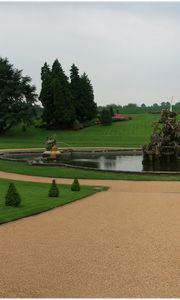 Preview wallpaper fountain, statue, figure, center, garden, lawn, cloudy