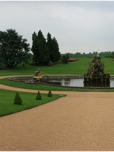 Preview wallpaper fountain, statue, figure, center, garden, lawn, cloudy