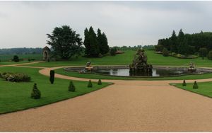 Preview wallpaper fountain, statue, figure, center, garden, lawn, cloudy