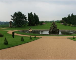 Preview wallpaper fountain, statue, figure, center, garden, lawn, cloudy