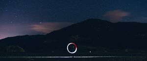 Preview wallpaper freezelight, circle, glow, hill, starry sky, stars