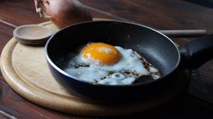 Preview wallpaper fried eggs, onion, pan, cutting board