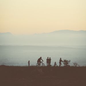 Preview wallpaper friends, silhouettes, mountains, nature, light