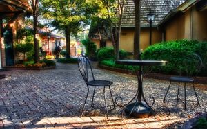 Preview wallpaper garden, plants, sculptures, houses, table, chairs, autumn, leaves