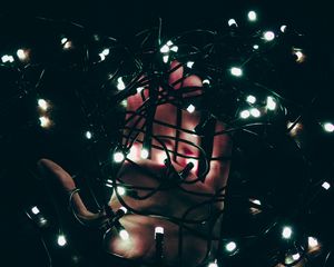 Preview wallpaper garland, hand, light, dark