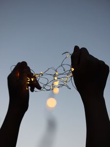 Preview wallpaper garland, hands, shine, light