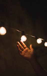 Preview wallpaper garland, light bulbs, hand, touch, light