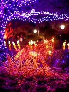 Preview wallpaper garlands, lights, animal, grass, glow