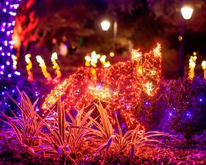 Preview wallpaper garlands, lights, animal, grass, glow