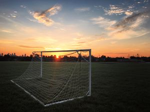 Preview wallpaper gate, net, field, sunset, football, sport