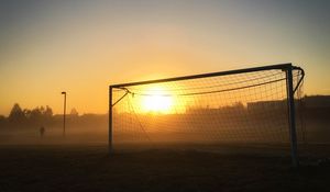 Preview wallpaper gate, net, sun, light, football, dark