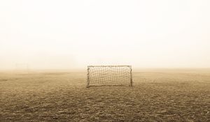 Preview wallpaper gates, fog, lawn, football, alone