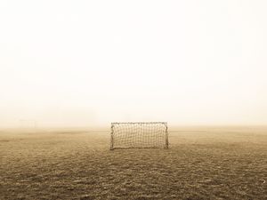 Preview wallpaper gates, fog, lawn, football, alone