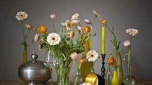Preview wallpaper gerbera, ranunkulyus, flowers, glasses, candles, vases, decoration
