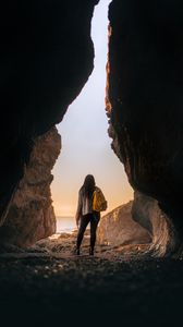 Preview wallpaper girl, alone, cave, sunset