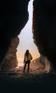 Preview wallpaper girl, alone, cave, sunset