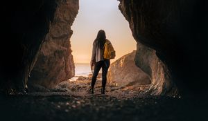 Preview wallpaper girl, alone, cave, sunset