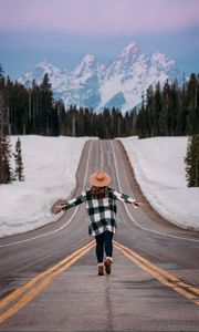 Preview wallpaper girl, alone, freedom, free, road, mountains, snow, winter