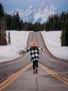 Preview wallpaper girl, alone, freedom, free, road, mountains, snow, winter