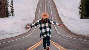 Preview wallpaper girl, alone, freedom, free, road, mountains, snow, winter