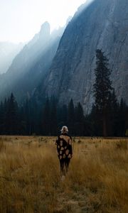 Preview wallpaper girl, alone, nature, mountains, grass