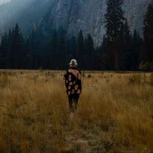 Preview wallpaper girl, alone, nature, mountains, grass