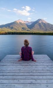 Preview wallpaper girl, alone, pier, water, mountains, view