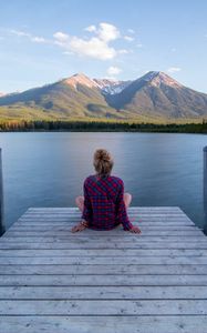 Preview wallpaper girl, alone, pier, water, mountains, view