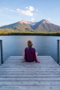 Preview wallpaper girl, alone, pier, water, mountains, view