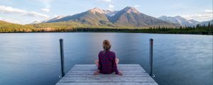 Preview wallpaper girl, alone, pier, water, mountains, view