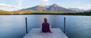 Preview wallpaper girl, alone, pier, water, mountains, view