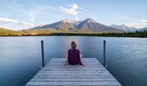 Preview wallpaper girl, alone, pier, water, mountains, view